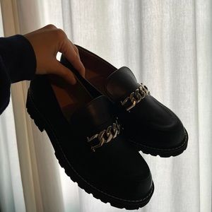 BCBG Generation black leather loafers with silver hardware detailing